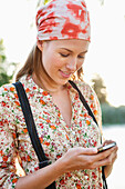 Close-up of a beautiful woman text messaging on a mobile phone