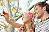 Young couple taking a picture of themselves with a mobile phone