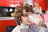 Portrait of a boy drinking a glass of milk