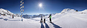 Skiers on the zugspitzplateau, Sonnalping Glacier Restaurant in the background, Zugspitze, Upper Bavaria, Bavaria, germany