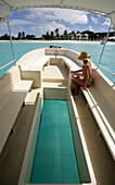 Woman in a glass bottom boat, Anguilla, Caribbean