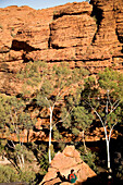 Man sitting in gorge at Kings Canyon, Watarrka National Park, Australia