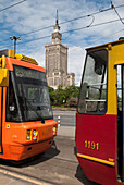 Trams passing the Communist era built Palace of Culture and Science building, Warsaw, Poland