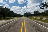 Road stretching into the distance on Route 16 in Bandera County, Bandera County, Texas, USA