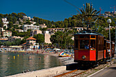 Port Soller to Soller tram going past the beach, Port Soller, Majorca, Spain
