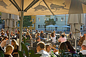 Locals at riverside cafe, Ljubljana, Slovenia
