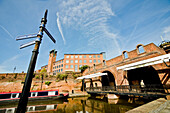 Buildings surrounding basin and canal in Castlefield, Manchester, England.
