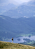 Walker admiring the view over Rydal Water, Lake District, England