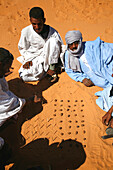 Africa, Maghreb, North africa, Mauritania, Adrar area (south of Atar), Mheyreth (or Mhaireth), men playing in the sand