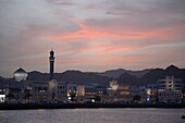 Oman, Muscat, Mutrah, skyline at sunset