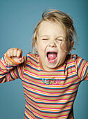 Portrait of little girl shouting
