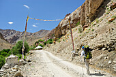 Woman coming near Honupatta, Zanskar Range Traverse, Zanskar Range, Zanskar, Ladakh, Jammu and Kashmir, India