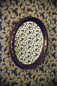 Old Wallpaper Reflected in Old Mirror