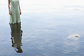 Girl in Polka Dot Dress Standing in Water