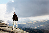 Young Man Standing on Edge of Cliff, Andalusia, Spain
