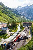 Village and Gletsch train station, steam train and steam lokomotive of Furka steam mountain railway, Valais, Switzerland