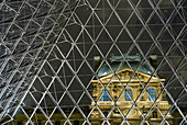 Looking out of the pyramid to the Louvre Museum at night, Paris, France