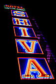 Neon on side of hotel building, Delhi, India