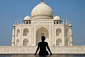 Silhouette of woman admiring the Taj Mahal, Rear View, Agra, Uttar Pradesh, India