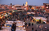 High angle view of Mosque and main square Djemma el Fna at dusk, Marrakesh, Marrakech, Morocco