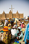 Market place with Djenne mosque in background, Djenne, Mali