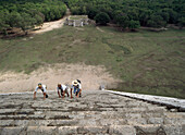 People climbing a pyramid, El Castillo, Chichen Itza Ruins, Mexico