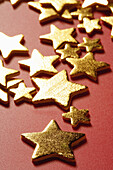 Christmas Golden stars over red background