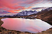 Clouds above mountain lake in the evening with Tribulaun range in background, valley of Obernberg, Stubai range, Tyrol, Austria, Europe