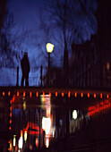 Reflections of people on bridge, Red Light district, Amsterdam, Holland