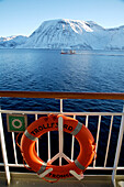 View of snowcapped mountains from ship, Norway