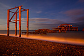Ruins of the western pier at dusk, Brighton, East Sussex, UK.