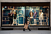 Woman Passing By A Designer Shop In 5Th Avenue, Midtown Manhattan, New York, USA