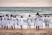 Tamil school kids bathing at beach Galle Face Green in the capital Colombo, Sri Lanka, long time exposure