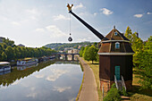 View of crane Saarkran and Old Bridge at the river Saar in the sunlight, Saarbruecken, Saarland, Germany, Europe