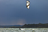 Kitesurfer at lake Chiemsee, Chieming, Chiemgau, Upper Bavaria, Germany