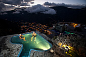 An elderly couple, a man and a woman in the hotsprings of Luna Runtun above the town of Baños, Andes, Ecuador, South America