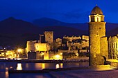 France, Languedoc-Roussillon, Pyrennes-Orientales Department, Vermillion Coast Area, Collioure, Chateau Royal and Eglise Notre Dame des Anges, evening