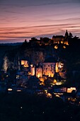 France, Midi-Pyrenees Region, Lot Department, Rocamadour, elevated town view, dusk