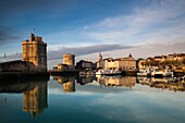 France, Poitou-Charentes Region, Charente-Maritime Department, La Rochelle, Old Port, Tour St-Nicholas and Tour de la Chaine towers, morning