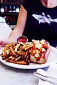 Traditional lobster roll, Neptune Oyster seafood restaurant, Boston, Massachusetts, USA