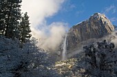 Upper Yosemite Fall waterfall after a spring snow storm, Yosemite National Park, California