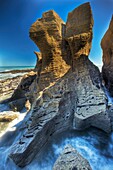 Pancake rocks, stacked limestone layers near Dolomite Point, Punakaiki, Paparoa National Park, West Coast, New Zealand