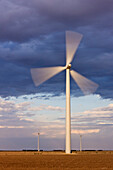 Wind Turbine Spinning at Dusk, Roscoe, Texas, USA