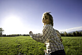 Smiling Young Girl Running in Grass Field, Oak Creek, Colorado, USA