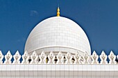 Exterior domes, arches and minarets of the the Sheikh Zayed Grand Mosque in Abu Dhabi, UAE