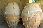 Pithoi storage jars supposedly used for storing wine, cereals, olive oil  Knossos, the Minoan Palace lies 5 kilometres southeast of Heraklion, in the valley of the river Kairatos  Crete Island  Greece