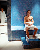 Man taking a footbath, spa resort, Travemuende, Luebeck, Schleswig-Holstein, Germany