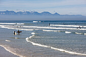 View of surfers on the beach, Muizenberg, Peninsula, Cape Town, South Africa, Africa