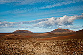 Volcanic landscape under clouded sky, Timanfaya National Park, Lanzarote, Canary Islands, Spain, Europe