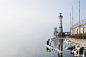 Port entrance with lighthouse, Lindau, Lake Constance, Bavaria, Germany